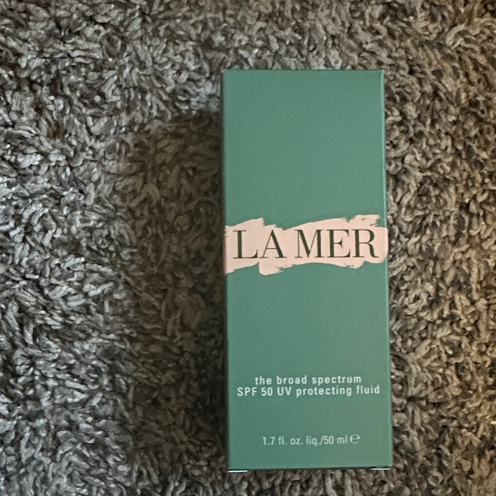 La Mer: The Broad Spectrum SPF 50 UV Protecting Fluid (1.7 fl. oz. / 50 ml).
